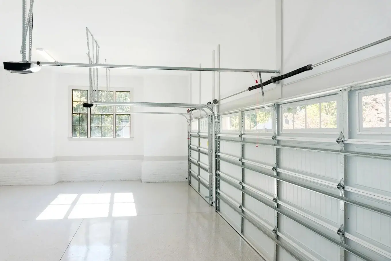 Bright garage interior with clean garage door track and opener hardware