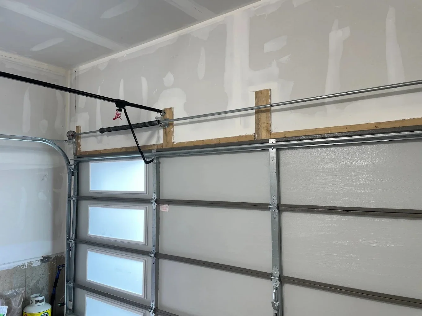 Interior view of modern garage door track and torsion system