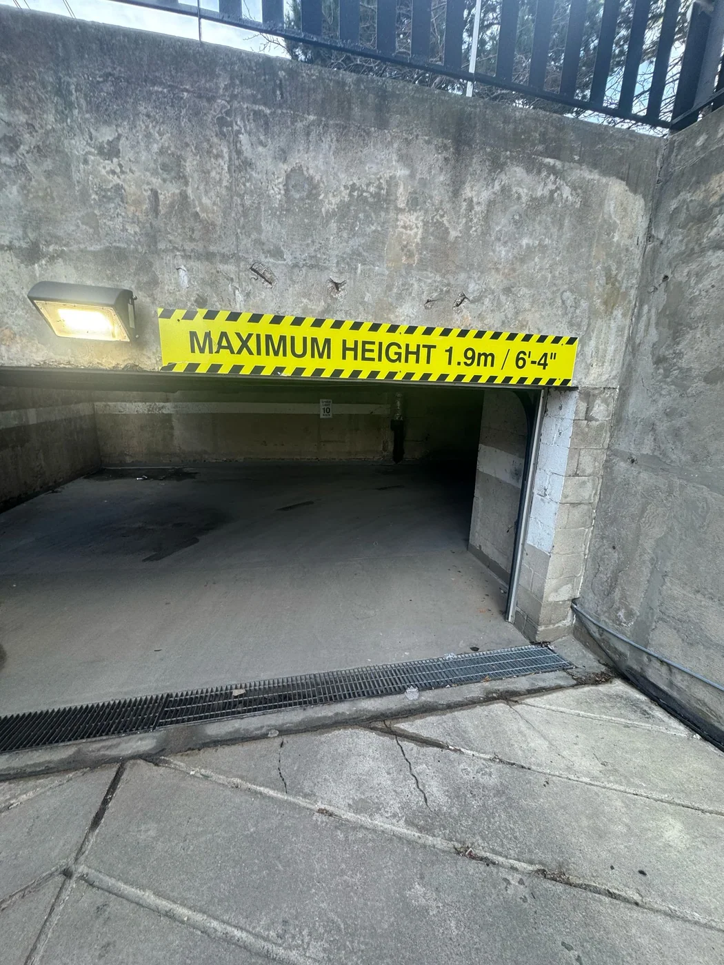 Low-clearance garage opening with maximum height sign above the entrance